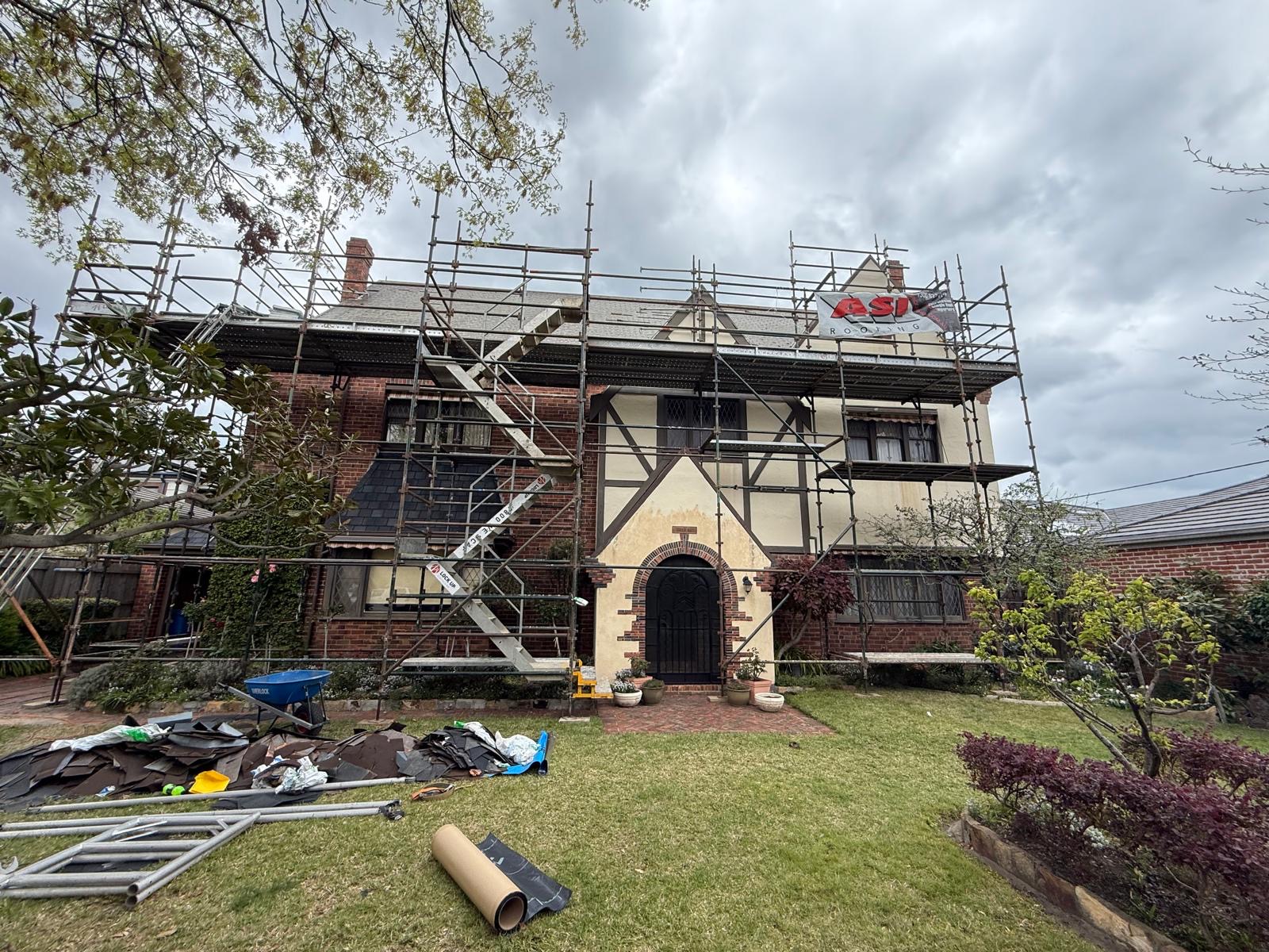 Tudor house before painting with scaffolding
